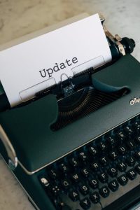 a type writer with the word 'update' typed on white paper